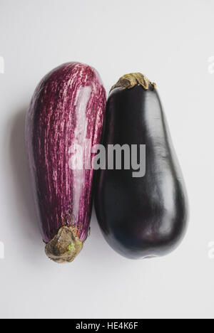 Two purple eggplants aubergines on white background Stock Photo