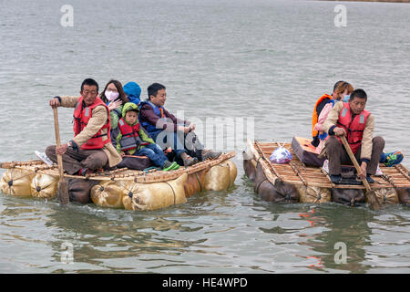 Chinese tourists on Yellow River raft, Shapotou Scenic Area, Zhongwei, Ningxia, China Stock Photo