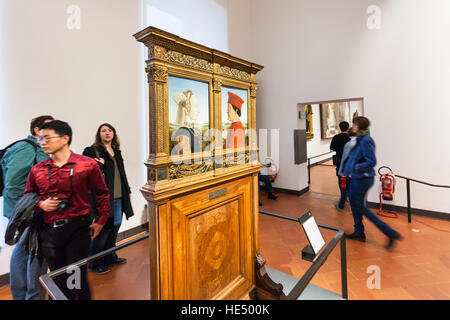 FLORENCE, ITALY - NOVEMBER 5, 2016: visitors in room of Uffizi Gallery. The Uffizi is one of the oldest museums in Europe, its origin refers to 1560, Stock Photo