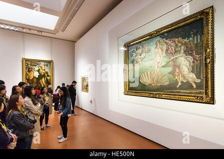 FLORENCE, ITALY - NOVEMBER 5, 2016: tourists in Botticelli room of Uffizi Gallery. The Uffizi is one of the oldest museums in Europe, its origin refer Stock Photo