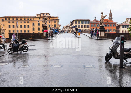 FLORENCE, ITALY - NOVEMBER 5, 2016: people on Ponte Santa Trinita over Arno river Florence city in autumn. The Ponte Santa Trinita is the oldest ellip Stock Photo