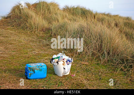 Rubbish collected in sand dunes in an Area of Outstanding Natural Beauty at Burnham Overy, Norfolk, England, United Kingdom. Stock Photo