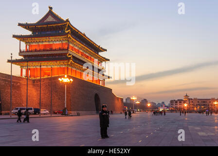 Peking: Tiananmen Square, Qianmen tower of the city wall, watchful policeman, Beijing, China Stock Photo