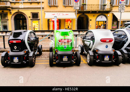 A number of Renault Twizy two seater city vehicles lined up at a charging station. Stock Photo