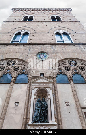 travel to Italy - building of medieval Orsanmichele church with statue Christ and St Thomas in Florence city Stock Photo