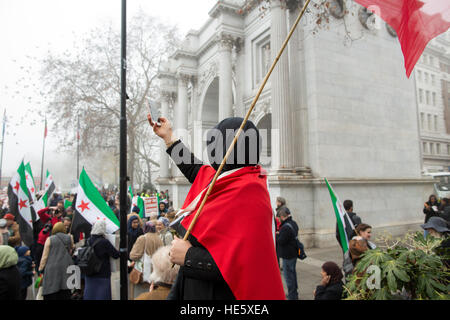 London, UK. 17th Dec, 2016. A protestor takes a selfie at the save Aleppo march, Marble Arch - 17/12/2016 © Edward Jonkler/Alamy Live News Stock Photo