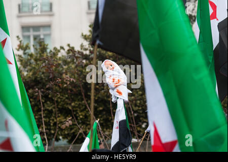 London, UK. 17th December 2016. Hundreds of demonstrators took part in 'March for Aleppo' in central London to show solidarity with people from the besieged city of Aleppo and other areas of war-torn Syria. The participants urged the international community to take action regarding atrocities against civilians and increase efforts to resolve humanitarian crisis in the war zones of Syria. Wiktor Szymanowicz/Alamy Live News Stock Photo