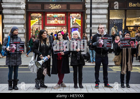 London, UK. 17th December, 2016. Animal rights activists take part in a vegan outreach demonstration named Awakening Compassion in Regent Street. Credit: Mark Kerrison/Alamy Live News Stock Photo