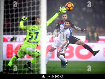 Milan. 17th Dec, 2016. Juraj Kucka (back) of AC Milan shoots the ball as Marco Sportiello of Atalanta reaches out for a save during the Italian Serie A football match in Milan on Dec. 17, 2016. © Daniele Mascolo/Xinhua/Alamy Live News Stock Photo