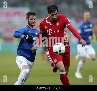 Darmstadst, Germany. 18th Dec, 2016. Darmstadt's Marcel Heller and Munich's Javi Martinez compete for the ball during the Bundesliga soccer match between Darmstadt 98 and Bayern Munich at Jonathan Heimes stadium in Darmstadst, Germany, 18 December 2016. Photo: Hasan Bratic/dpa/Alamy Live News Stock Photo
