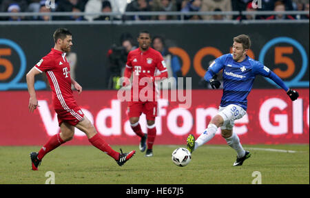 Darmstadst, Germany. 18th Dec, 2016. Darmstadt's Sven Schipplock (r) and Munich's Xabi Alonso compete for the ball during the Bundesliga soccer match between Darmstadt 98 and Bayern Munich at Jonathan Heimes stadium in Darmstadst, Germany, 18 December 2016. Photo: Hasan Bratic/dpa/Alamy Live News Stock Photo