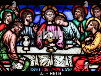 Stained glass window depicting Jesus and the twelve apostles on maundy thursday at the Last Supper in the cathedral of Brussels, Belgium. Stock Photo