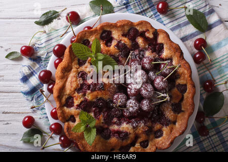 homemade cherry cake close-up on a plate on the table. horizontal view from above Stock Photo