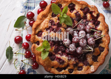 homemade cherry cake close up on a plate on the table. horizontal view from above Stock Photo