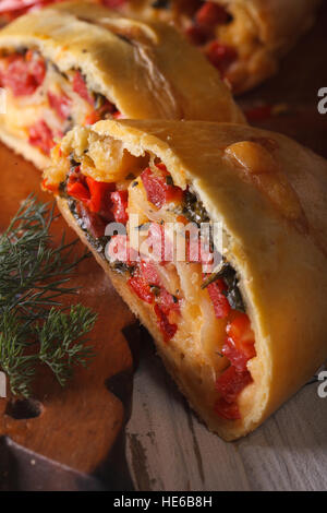 homemade pie with ham, cheese and vegetables macro. vertical Stock Photo