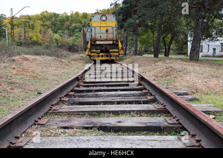 Abandoned Russian railroad tracks and locomotive from Soviet era, in Georgia, Caucasus Stock Photo