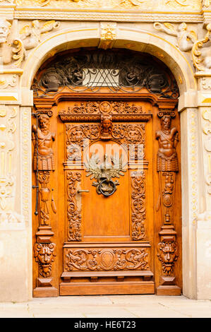 Ornately carved wooden door in Gdansk, Poland. Stock Photo