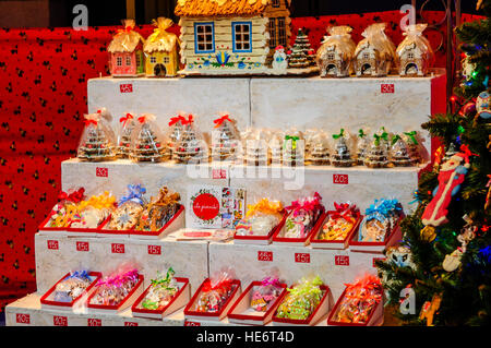 Traditional gingerbread houses, trees and biscuits on sale at a stall at the Christmas Market, Gdansk, Poland Stock Photo