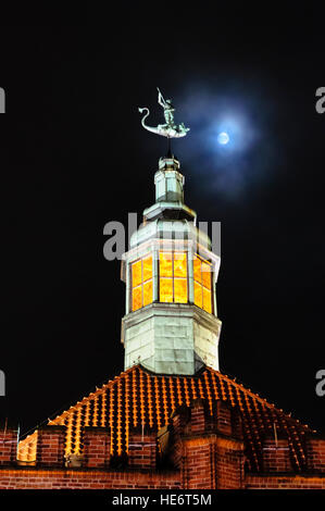 Copper skylight on the roof of a building in Gdansk, with the moon behind. Stock Photo