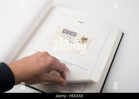 An album with a collection of  postage stamps. Stock Photo