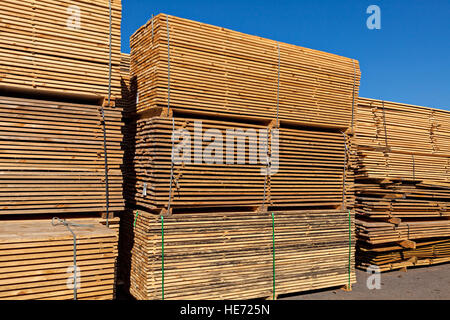 Stack of wooden boards in sawmill Stock Photo