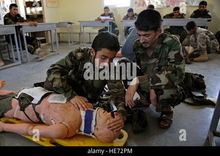 Afghan National Army soldiers simulate close quarters fighting during a ...