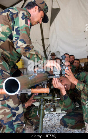 An instructor teaches Afghan National Army trainees squad attack skills ...