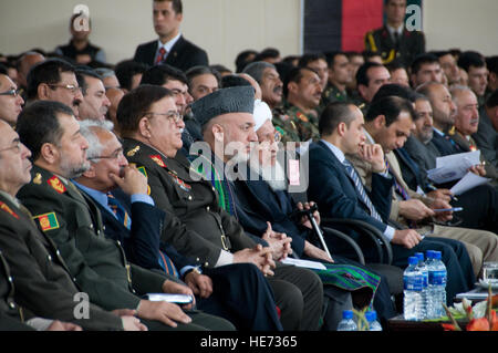 100318-F-1020B-121 Kabul - Afghan President Hamid Karzai listens to a speech at the National Military Academy of Afghanistan, where the class of 2010 was graduating March 18, 2010. Only the second class to graduate from the academy, which is modeled after the United States Military Academy  at West Point, the 212 new officers will join the Afghan National Army as lieutenants.  Staff Sgt. Sarah Brown/) Stock Photo