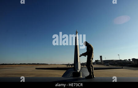 AC-130U gunship Crew Chief SrA. Robin Rose from the 4th Aircraft Maintenance Squadron, walks around on top of the plane performing routine maintenance checks on January 28,2011 at Hurlburt Field, Fla. The AC-130U 'Spooky' gunship is the primary weapon of Air Force Special Operations Command. Its primary missions are close air support, air interdiction and armed reconnaissance. The U model is an upgraded version of the H and is equipped with side firing, trainable 25mm, 40mm, and 105mm guns. ( Master Sgt. Jeremy T. Lock) (Released) Stock Photo