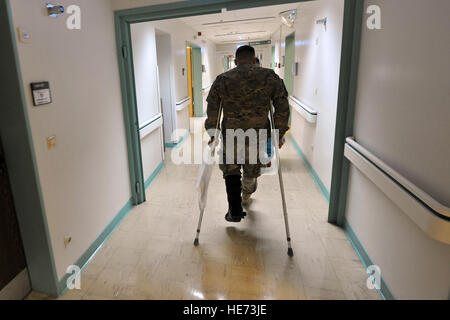 U.S. Army Sgt. Karl Berlinger makes his way to the orthopedic section for his initial observation Feb. 12, 2014, Landstuhl Regional Hospital, Germany. Berlinger received treatment for his injuries at LRMC within one hour of arrival from Bagram Air Field, Afghanistan. Senior Airman Chris Willis) Stock Photo