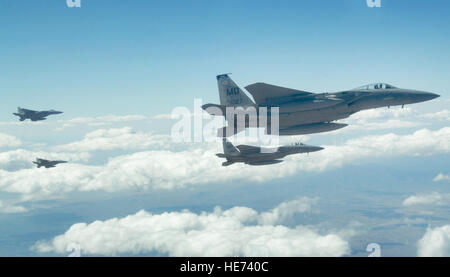 A four-ship formation of F-15 Eagles from Mountain Home Air Force Base, Idaho, head out to the Nevada Test and Training Range July 17 during Red Flag 09-4. Red Flag is conducted on the 15,000-square-mile range north of Las Vegas. The exercise is one of a series of advanced training programs administered by the U.S. Air Force Warfare Center and Nellis AFB. Master Sgt. Kevin J. Gruenwald) Stock Photo