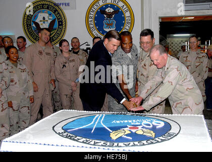 In the joint environment of the camp, right to left, Navy Rear Adm. James M. Hart assists Col. John M. Crocker, Brig. Gen. Alfred J. Stewart and Ambassador W. Stuart Symington in cutting the cake to celebrate the Heritage to Horizons theme of the Air Force's 60th birthday. Hart is the Combined Joint Task Force - Horn of Africa commander, Crocker is the 449th Air Expeditionary Group commander and Air Component Coordination Element director, Stewart is the Central Command director of mobility forces and Symington is the United States Ambassador of Djibouti and grandson of the first Secretary of  Stock Photo