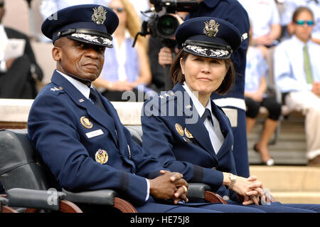 Maj. Gen. Darren W. McDew and Maj. Gen. Sharon K.G. Dunbar listen to remarks made by Air Force Vice Chief of Staff Gen. Philip M. Breedlove during the Air Force District of Washington change of command July 26 at Joint Base Anacostia-Bolling, Washington, D.C. During the ceremony, Dunbar assumed command from outgoing AFDW commander McDew. Senior Airman Steele C. G. Britton) Stock Photo