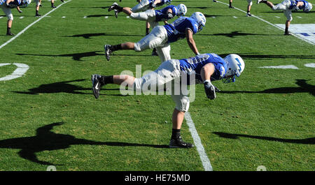 Falcon football players stretch before the Bell Helicopter Armed Forces Bowl game between the United States Air Force Academy and the University of Houston, Dec. 31 at Amon G. Carter Stadium, Forth Worth, Texas.  Staff Sgt. Bennie J. Davis III) Stock Photo