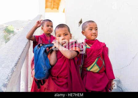 Diskit, India - August 20, 2015: Three young monks leaving Diskit monastery school. Stock Photo