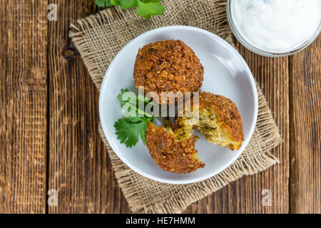 Wooden table with Falafels (close-up shot; selective focus) Stock Photo