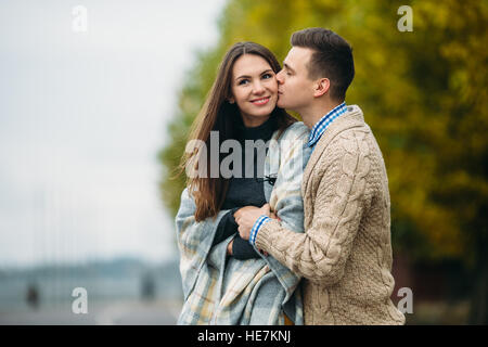 smiling couple in autumn park Stock Photo