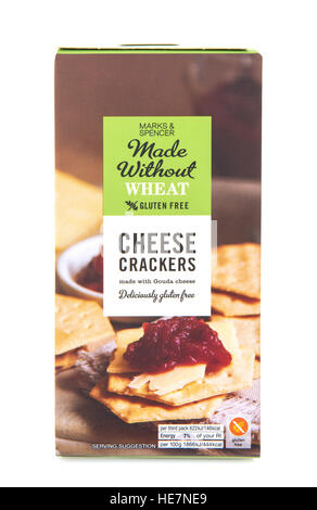 Marks And Spencer Wheat and Gluten Free Cheese Crackers with Gouda Cheese on a white background Stock Photo