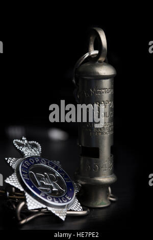 Metropolitan Police Badge and Whistle, issued to serving officers.  The whistle was used to summon assistance before radio Stock Photo