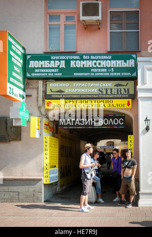 Store signs in a gateway on Arbat street in Moscow Stock Photo