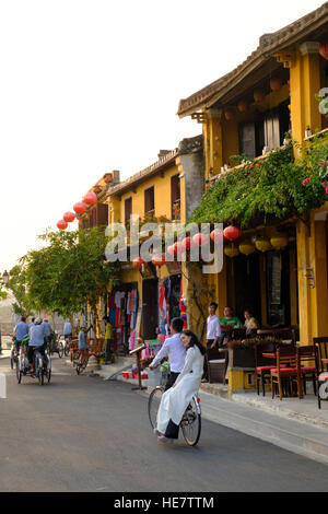 Couple riding a bicycle in Hoi An Stock Photo