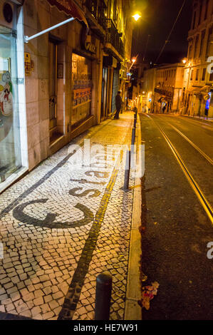 Marble sett pavement with name of shop "Estabelecimentos Cancela" spelt out, Calçada do Combro, Lisbon Portugal Stock Photo