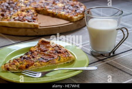 Homemade quiche (tart) with pickles, ham, prosciutto and cheese Stock Photo