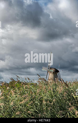 Kinderdijk The Netherlands - October 19: Kinderdijk windmill on a autumn day with cloudy skies one October 19, 2016. Stock Photo