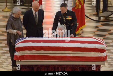 Daughter Lyn Glenn, son David Glenn, and wife Annie Glenn pay their respects to astronaut and former Senator John Glenn in repose at the Ohio Statehouse December 16, 2016 in Columbus, Ohio. The former Marine pilot, Senator and first man to orbit the earth died last week at the age of 95. Stock Photo