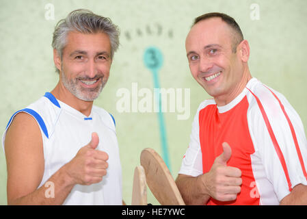 Sportsmen giving thumbs up Stock Photo