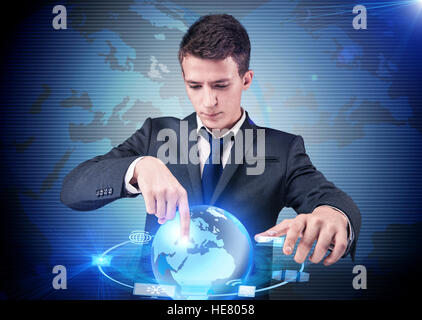 Businessman pressing buttons in computing concept Stock Photo