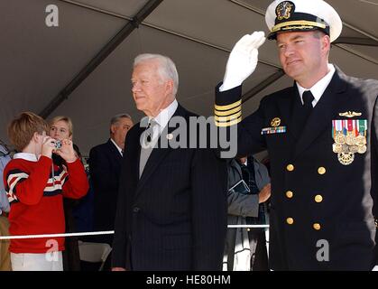 USN Commanding Officer Robert Kelso escorts former U.S. President Jimmy Carter past a crowd at the commissioning ceremony for the USN Seawolf-class attack submarine USS Jimmy Carter at the Naval Submarine Base New London February 19, 2005 in Groton, Connecticut.