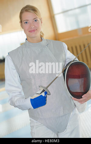 fencer posing and smiling Stock Photo