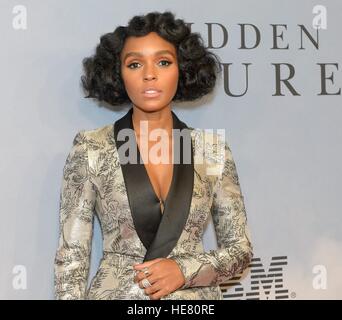 Musician Janelle Monae walks the red carpet during the global celebration event for the film Hidden Figures at the SVA Theatre December 10, 2016 in New York City, New York. The film is based on the true story of the African-American women who worked as human computers during the Friendship 7 mission in 1962. Stock Photo
